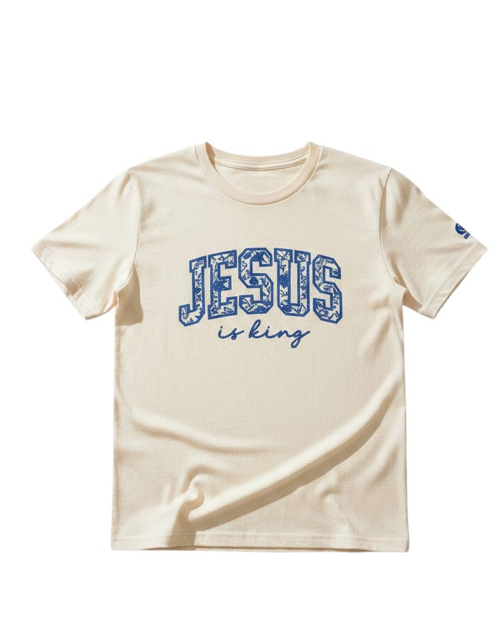 Beige t-shirt with 'Jesus is King' text on a white background