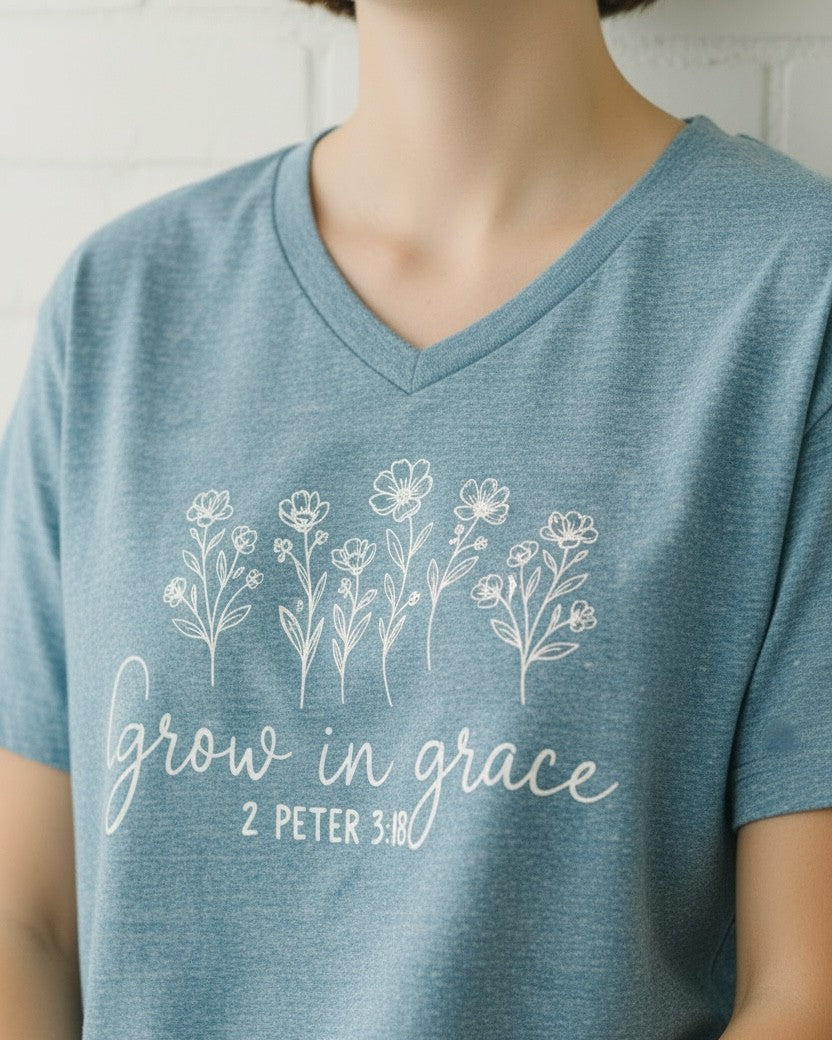 Blue t-shirt with floral design and 'Grow in grace 2 Peter 3:18' text on a white background