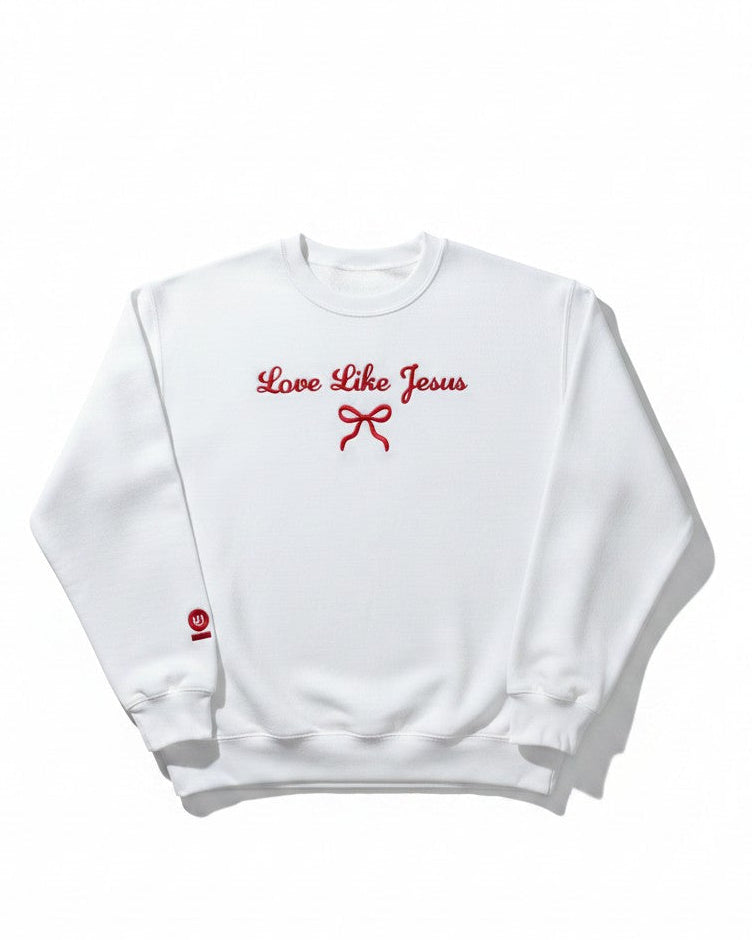White sweatshirt with 'Love Like Jesus' text and red graphics on a white background